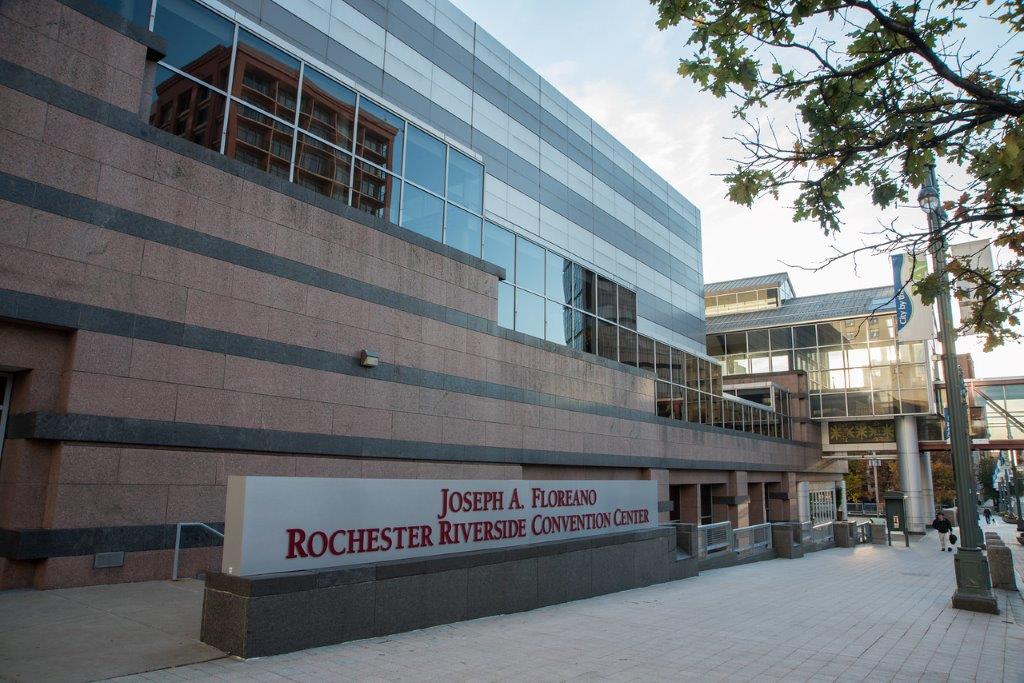 Exterior photo of the Joseph A. Floreano Rochester Riverside Convention Center including sign in front of building